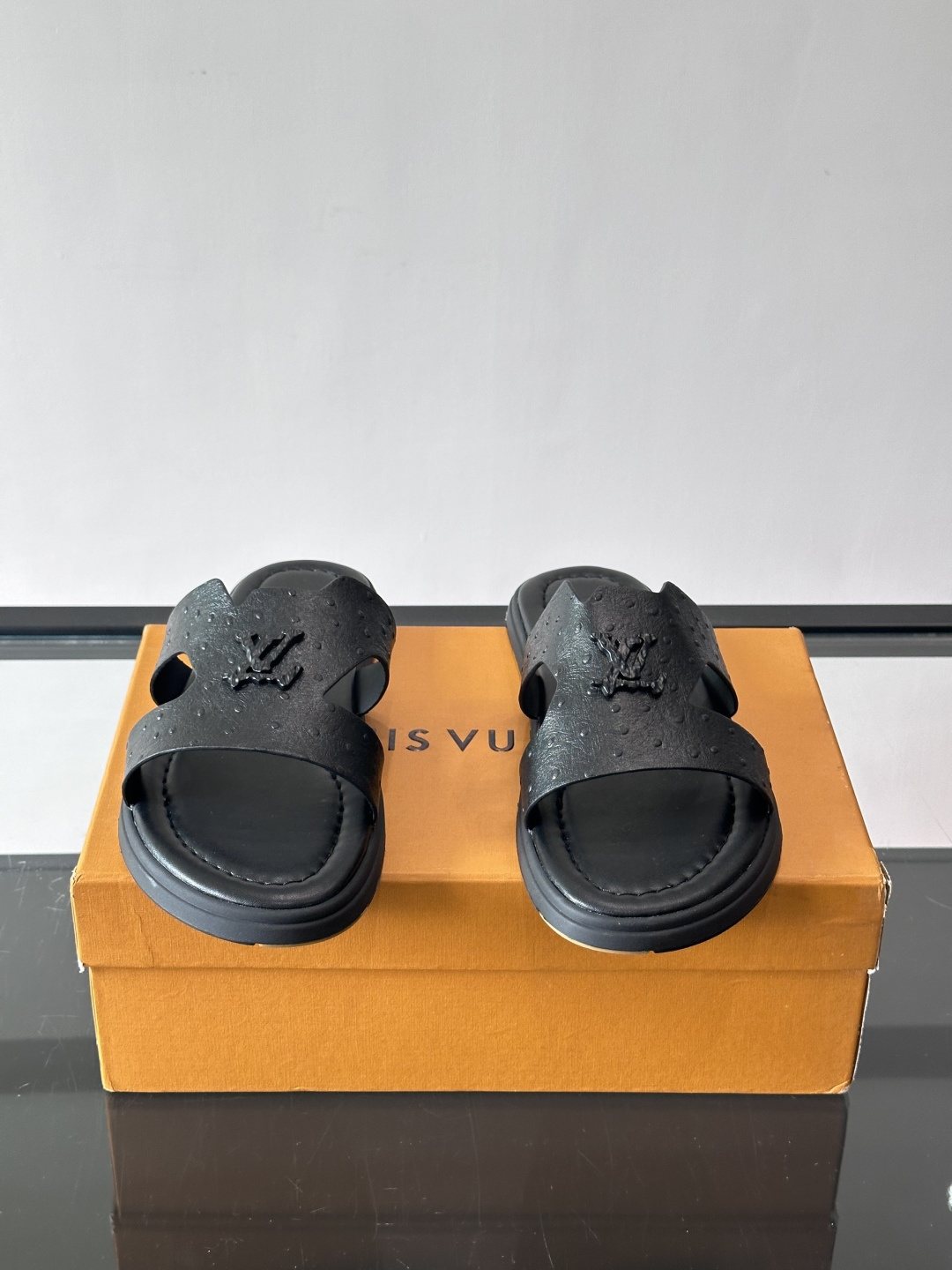 Louis Vuitton Black Embossed Slide Sandals — hero